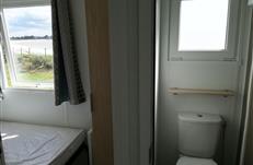 Mobil home en location en Bretagne. Mobile-home 3 chambres. 4/6 personnes Toilette séparé camping Les Goélands AMBON